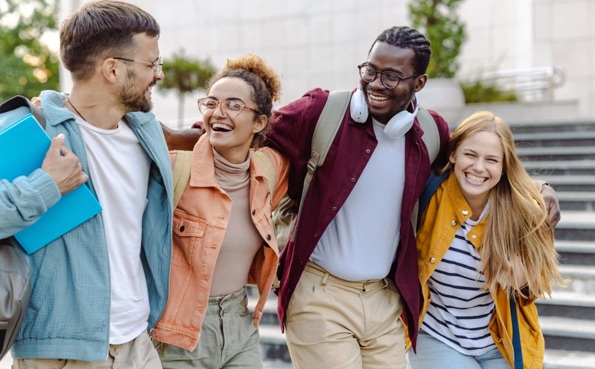 Happy group of students on the street