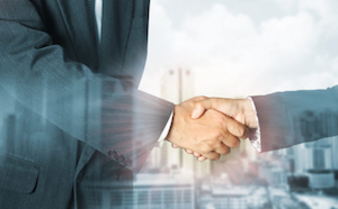 Double exposure of success businessman and Office workplace with laptop and smart phone on wood table and big city blurred background