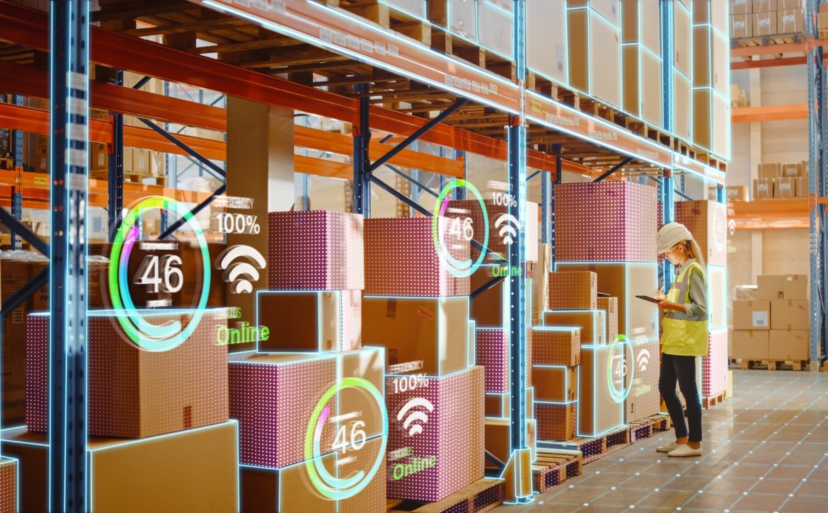 Futuristic Technology Retail Warehouse: Worker Starts Inventory Digitalization with Barcode Scanner Analyzes Goods, Cardboard Boxes, Products. Delivery Infographics in Logistics, Distribution Center