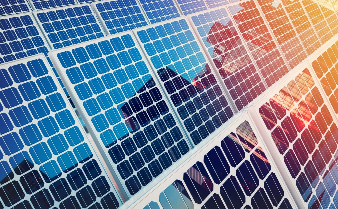 Solar panels on buildings reflect the city.